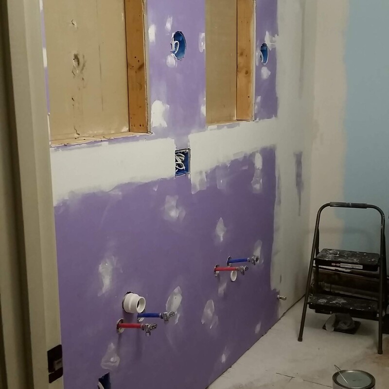 During - Rough in plumbing and openings for recessed medicine cabinets.